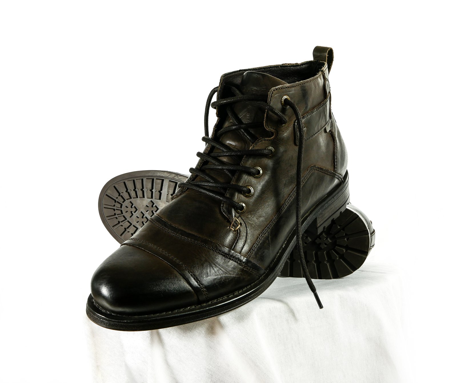 Selection of men's leather heritage boots on display showcasing service boot profiles