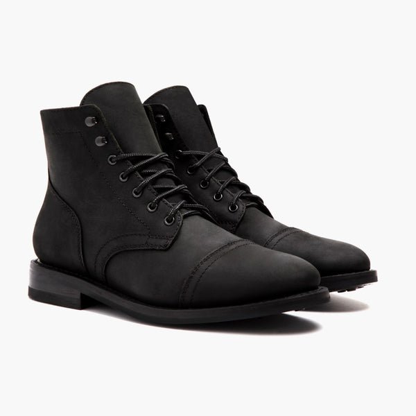 Thursday Boot Company Captain cap-toe service boot in matte black leather with studded rubber outsole